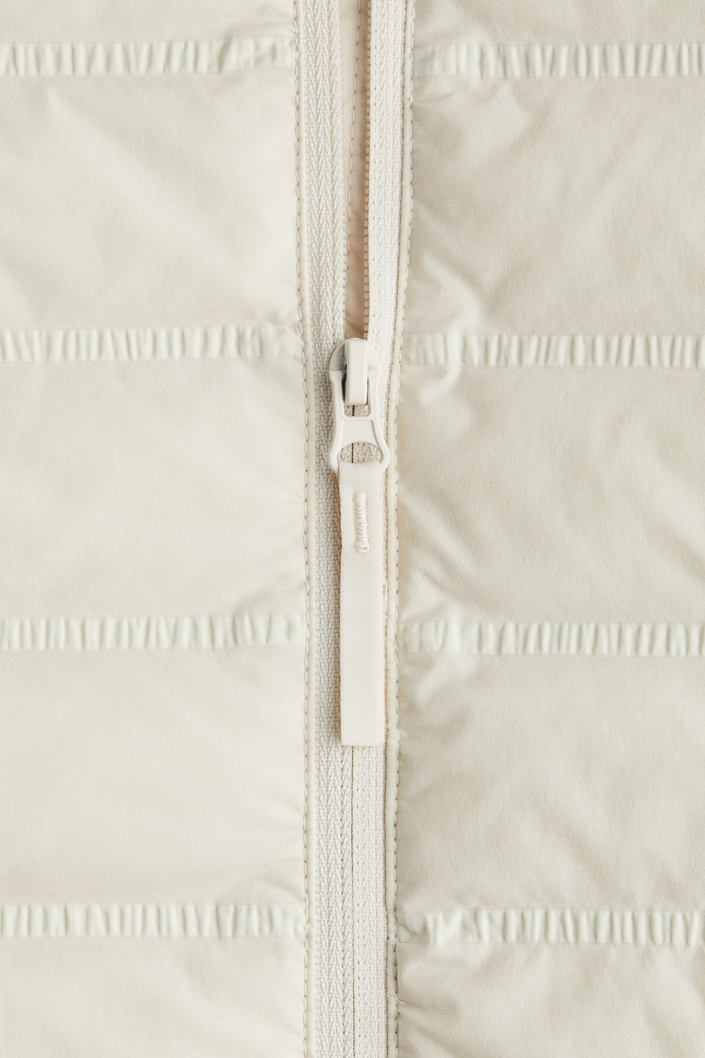 Куртка с регулируемым шнурком прямого кроя: детали изделия